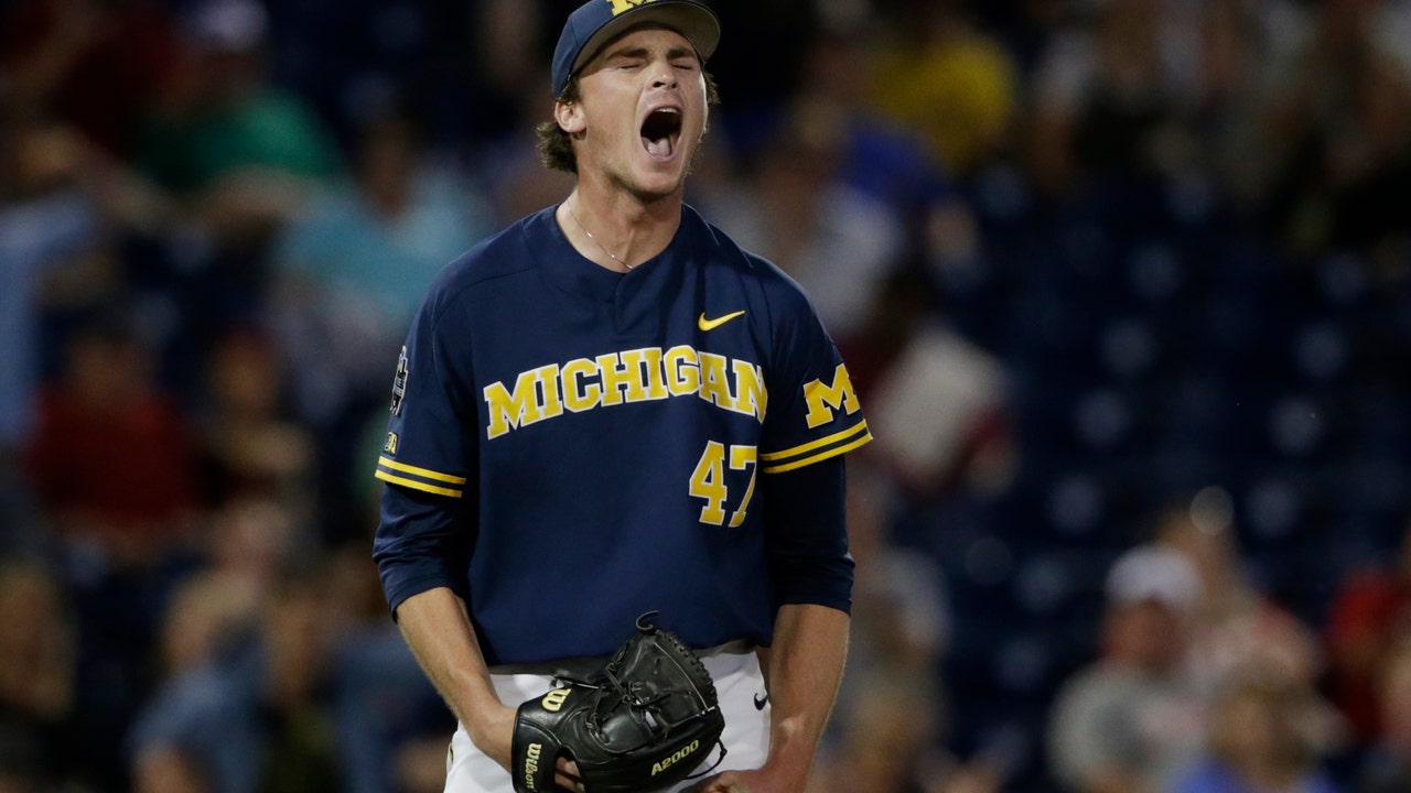 Michigan rides Henry's 3-hitter to 2-0 win over FSU at CWS